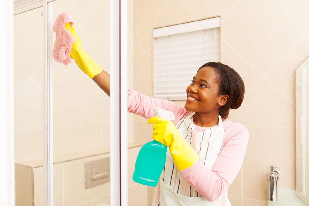 Woman Cleaning Shower